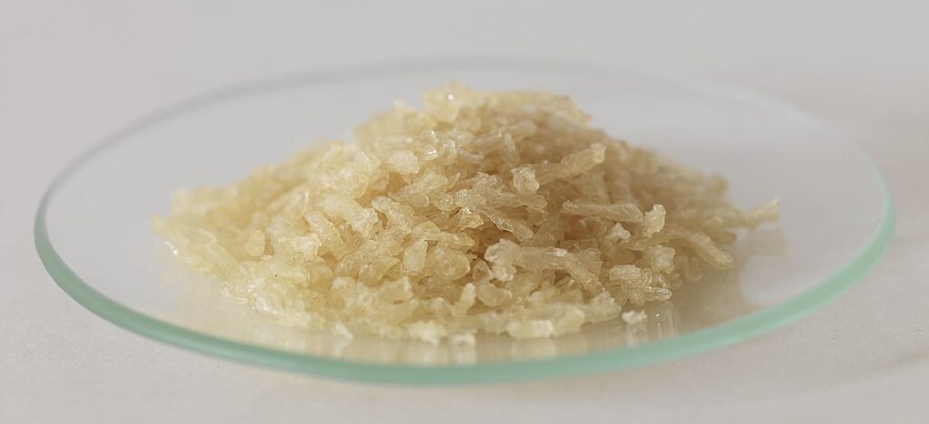 Gelatin flakes on a clear crystal plate